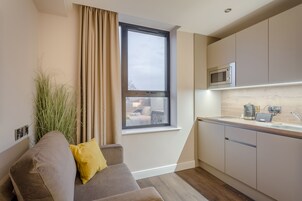 Fridge, microwave, stovetop, coffee/tea maker