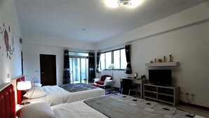 A hotel room with two beds, a desk, a TV, and a window with curtains. - Maple Farm (Guangfu)