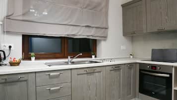 Family Apartment - Ground Floor | Private kitchen | Oven, stovetop, electric kettle, cookware/dishes/utensils