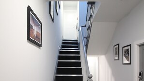 A staircase with a handrail, leading to a door at the top. - Apartments St Thomas Road (Chorley)