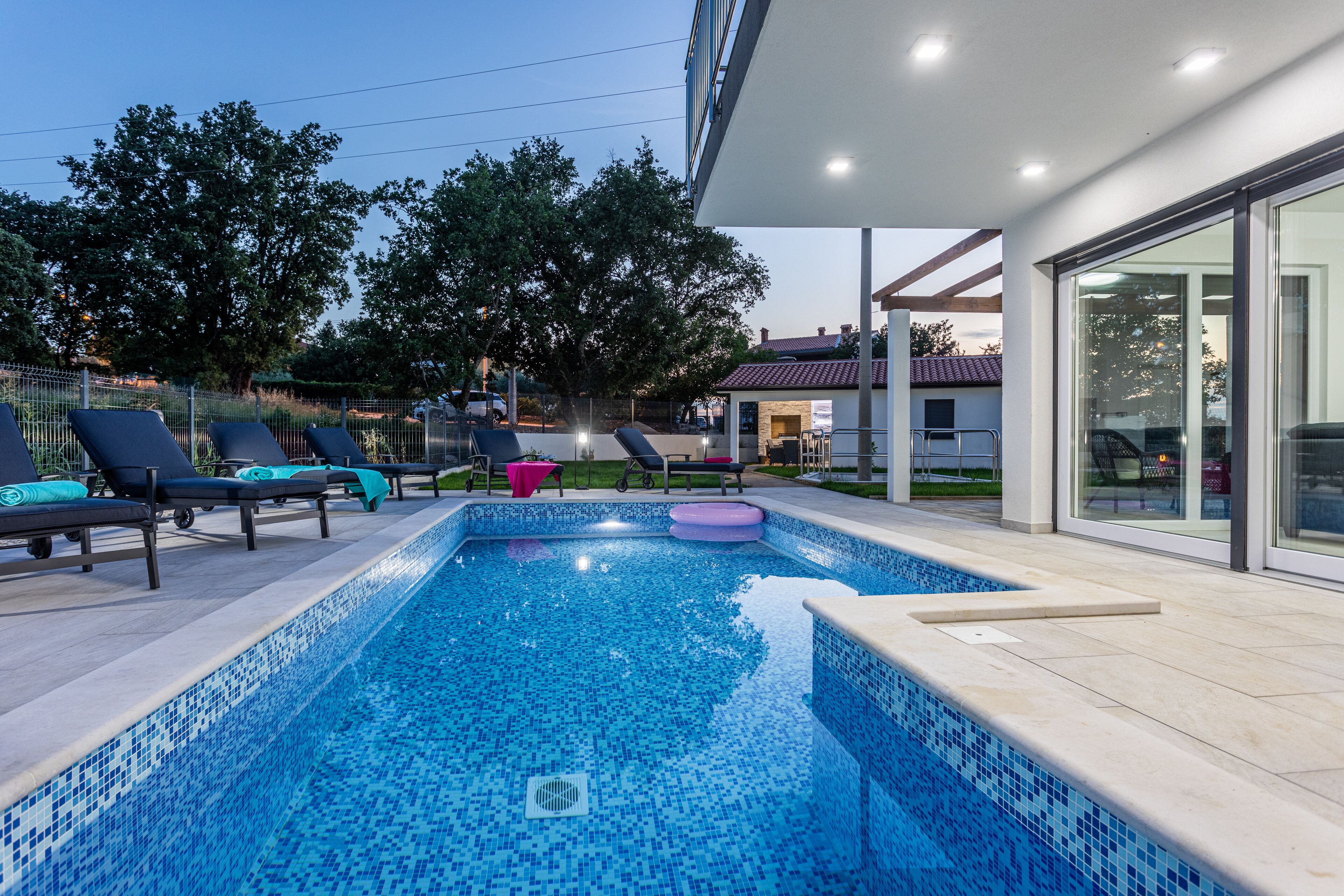 Outdoor pool, a heated pool, pool loungers