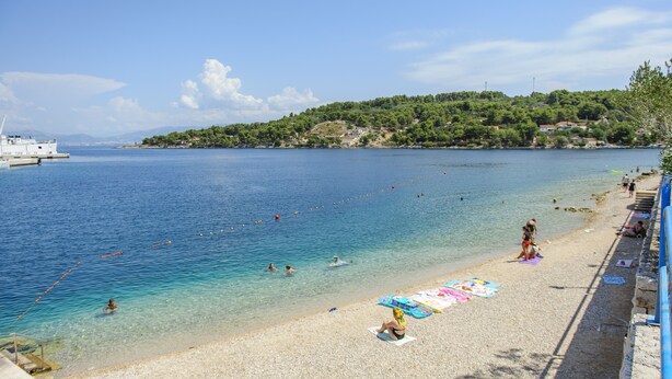 A beach with clear water, people swimming, and a boat in the distance. - LUXURY: VILLA on the SEA, POOL & BEACH BIKE & KAYAK & PRESENT (Rogac)