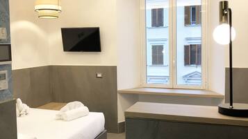 Down comforters, memory foam beds, in-room safe, desk