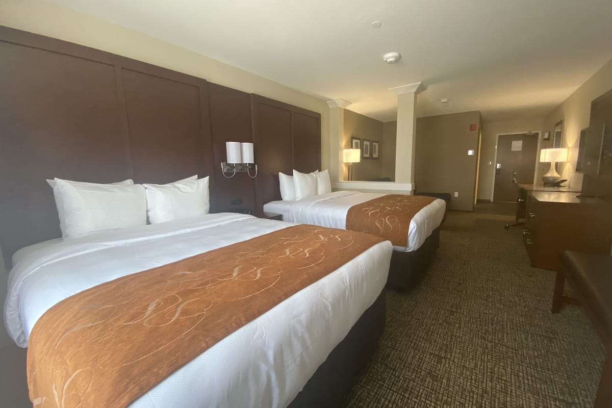 desk, laptop workspace, blackout curtains, iron/ironing board