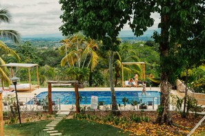 Outdoor pool, open 9:00 AM to 10:00 PM, pool umbrellas - Amaranthus Hotel (Puerto Triunfo)