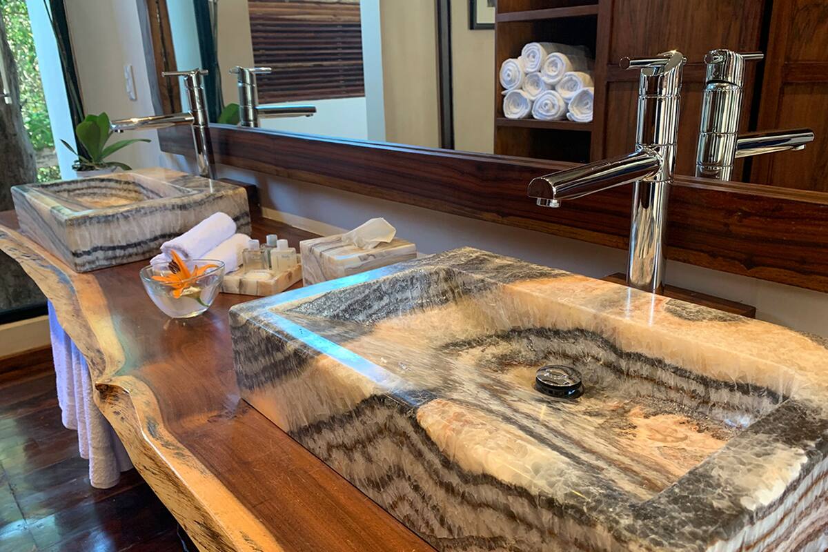 junior studio | bathroom | shower, rainfall showerhead, designer toiletries, hair dryer