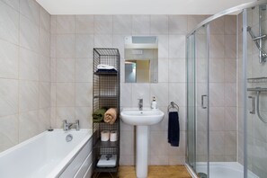 Combined shower/tub, hair dryer, towels, soap