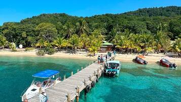 On the beach, sun-loungers