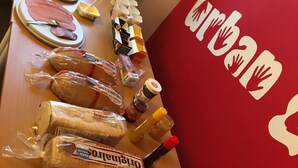 A breakfast bar with bread, butter, jam, and condiments. - Sleep And Go (Harnosand)