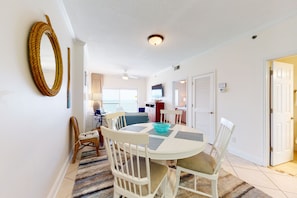 Enjoy meals in this dining area with a round table and comfortable seating for all.