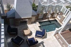 A rooftop patio with a hot tub, lounge chairs, and a fire pit area. - A Little Overboard, Private Pool/Spa, Easy walk to Beach, Golf Cart Included! (WaterSound)