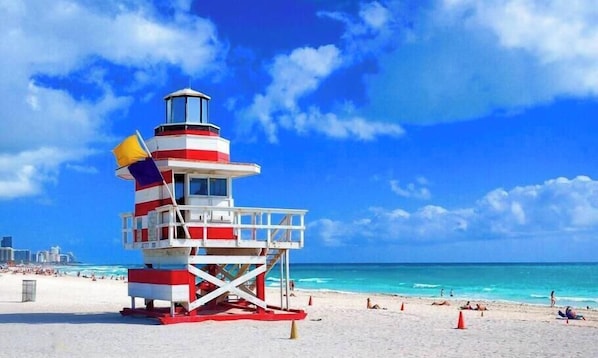 A lifeguard tower at Miami (South) Beach with a clear blue sky and turquoise ocean.