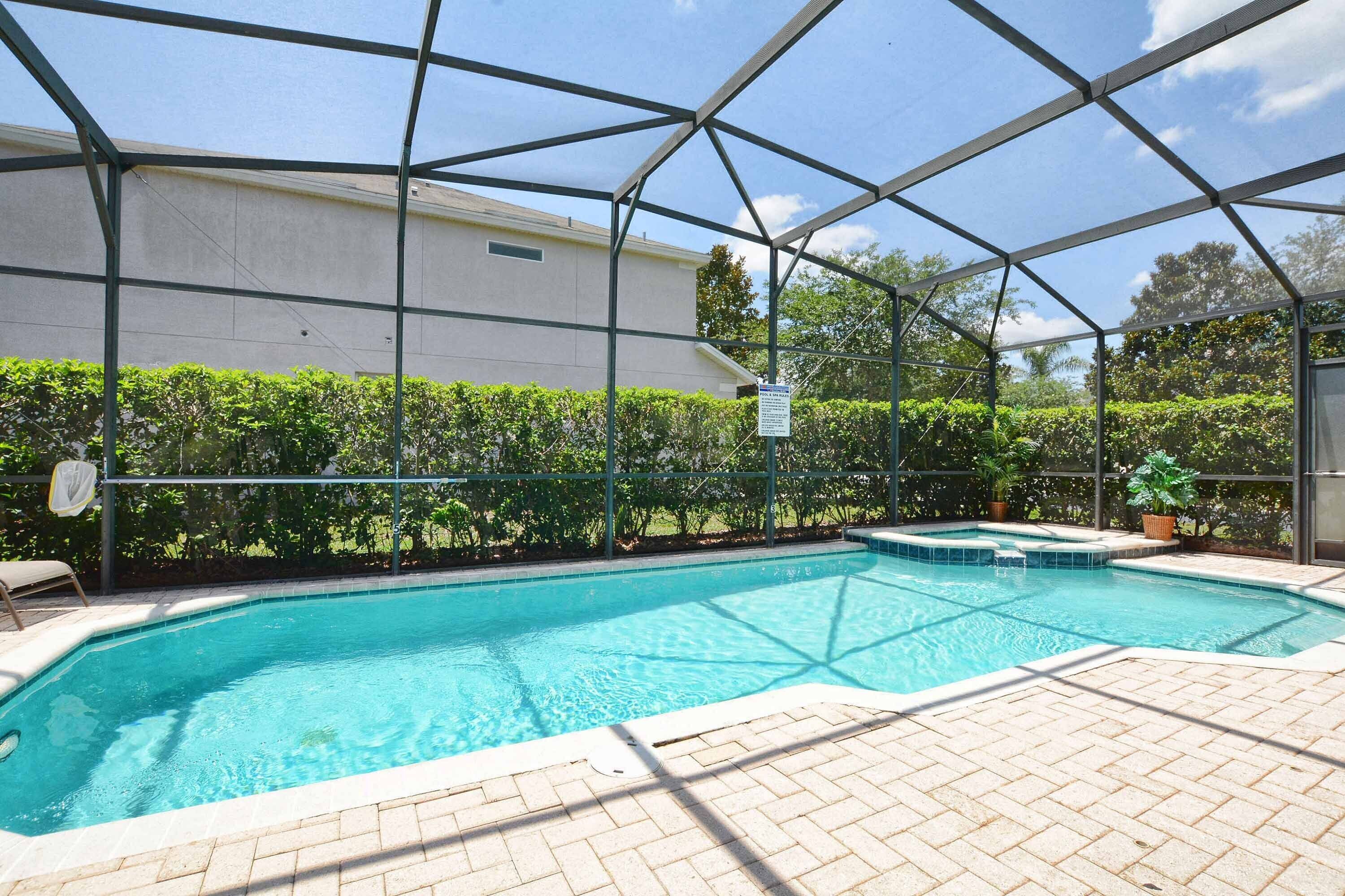 South facing saltwater pool & with hedges for privacy.