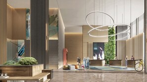 A modern lobby with a large digital screen, wooden benches, and a bike rack. - EVEN Hotel Nanjing Yangtze River by IHG (Nanjing)