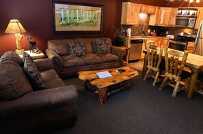 Condo, 2 Queen Beds, Balcony, River View | Living room | 42-inch TV with cable channels, fireplace