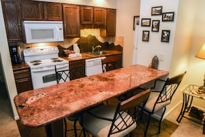 Apartment, 1 Queen Bed, Fireplace, River View | Private kitchen | Fridge, microwave, stovetop, dishwasher