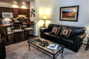 Apartment, 1 Queen Bed, Fireplace, River View | Living room | 42-inch TV with cable channels, fireplace