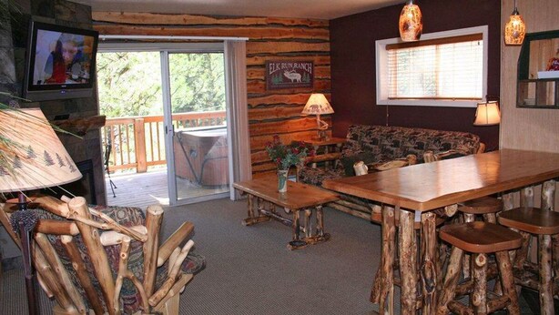 Condo, 1 King Bed, Hot Tub, River View | Living room | 42-inch TV with cable channels, fireplace - Fawn Valley Inn: 300 (Estes Park)