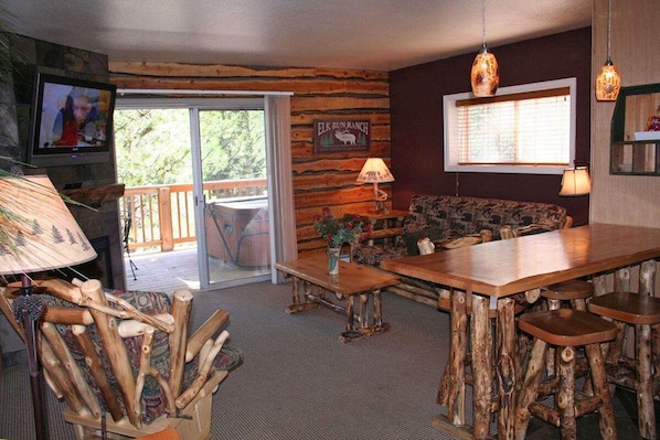 Condo, 1 King Bed, Hot Tub, River View | Living room | 42-inch TV with cable channels, fireplace