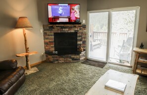 Apartment, 1 Queen Bed with Sofa bed, Hot Tub, River View | Living room | 42-inch TV with cable channels, fireplace