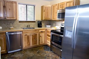 Cabin, Multiple Beds, Fireplace, Mountain View | Private kitchen | Fridge, microwave, stovetop, dishwasher
