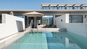 A modern pool area with clear water, a lounge chair, and a covered seating area. - Chq Galini Palace (Platanias)
