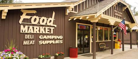 A building with a sign reading "Food Market" and "Deli Meat" on the side.