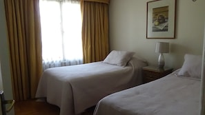 Desk, laptop workspace, free WiFi, bed sheets