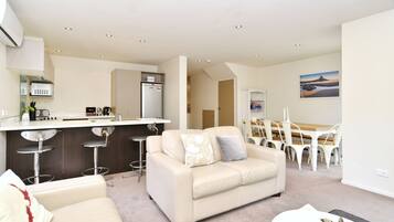 4 Bedroom Premium Apartment | Living area | 70-cm flat-screen TV with digital channels, TV