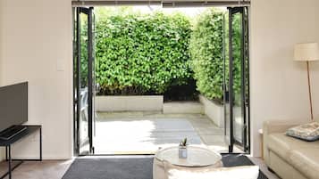 4 Bedroom Premium Apartment | Living area | 70-cm flat-screen TV with digital channels, TV