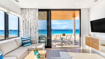 Luxury Condo, 1 Bedroom, Hot Tub, Beachfront | Living area | 55-inch flat-screen TV with cable channels