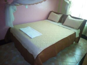 Desk, bed sheets - Palace Hotel (Embu)