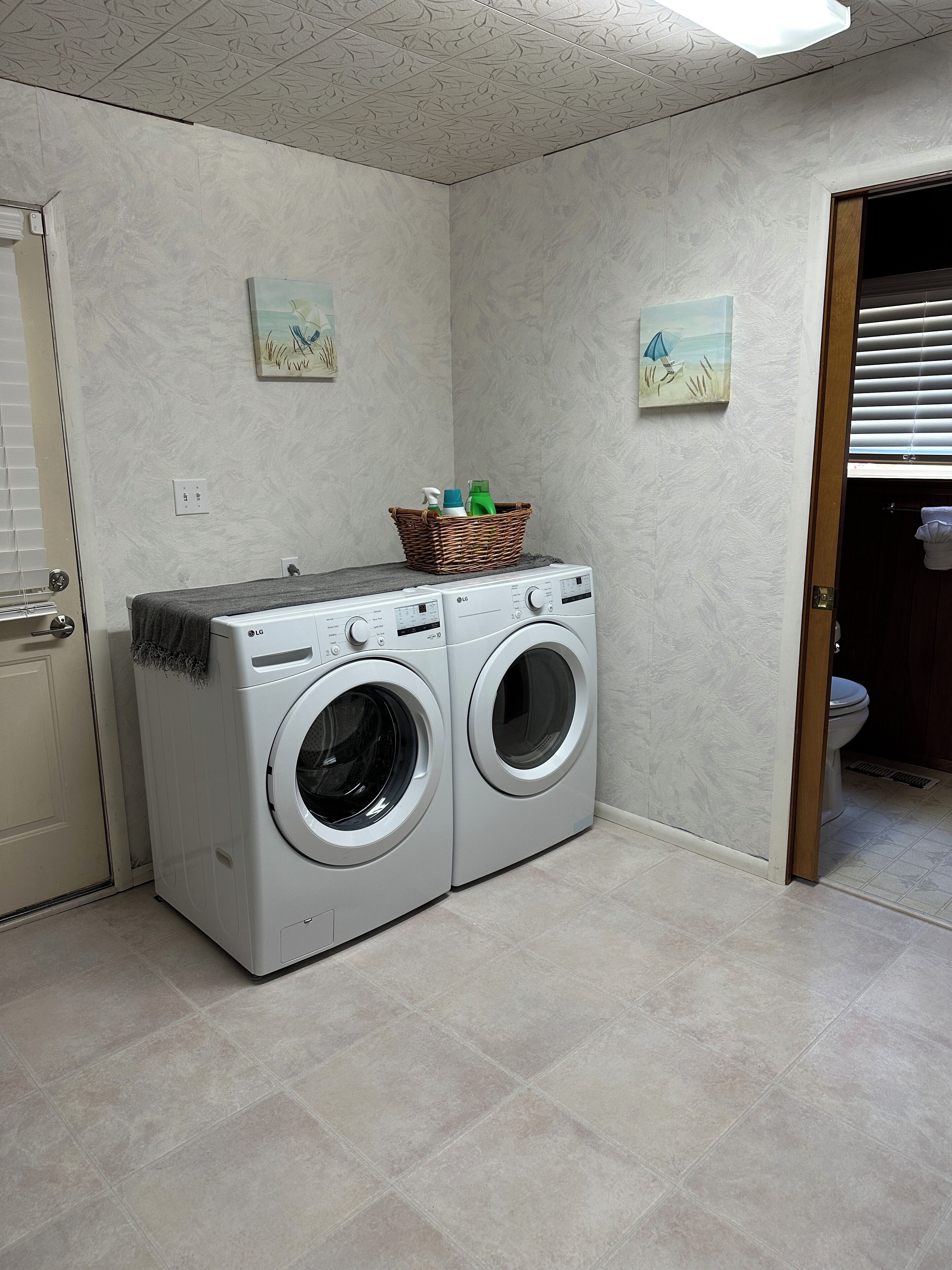 Laundry / mud room with LG full-sized HE washer and dryer