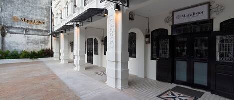 A building facade with the name 'Macalister' prominently displayed.