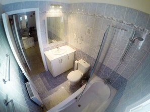 Combined shower/tub, hair dryer, towels, soap