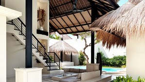 A modern outdoor living area with a pool, a covered seating area, and a staircase leading to an upper level. - Villa de Malicott (Seminyak)