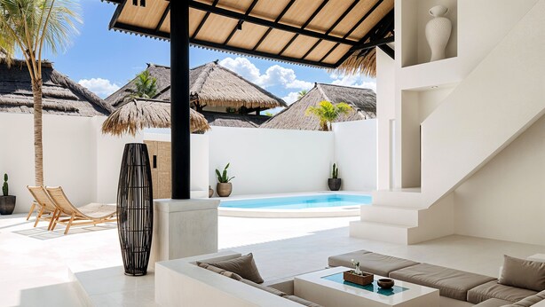 A modern outdoor living area with a pool, seating, and thatched-roof structures. - Villa de Malicott (Seminyak)