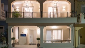 A two-story building with a balcony, a staircase, and potted plants. - B4B Sea n' City (Zakynthos)