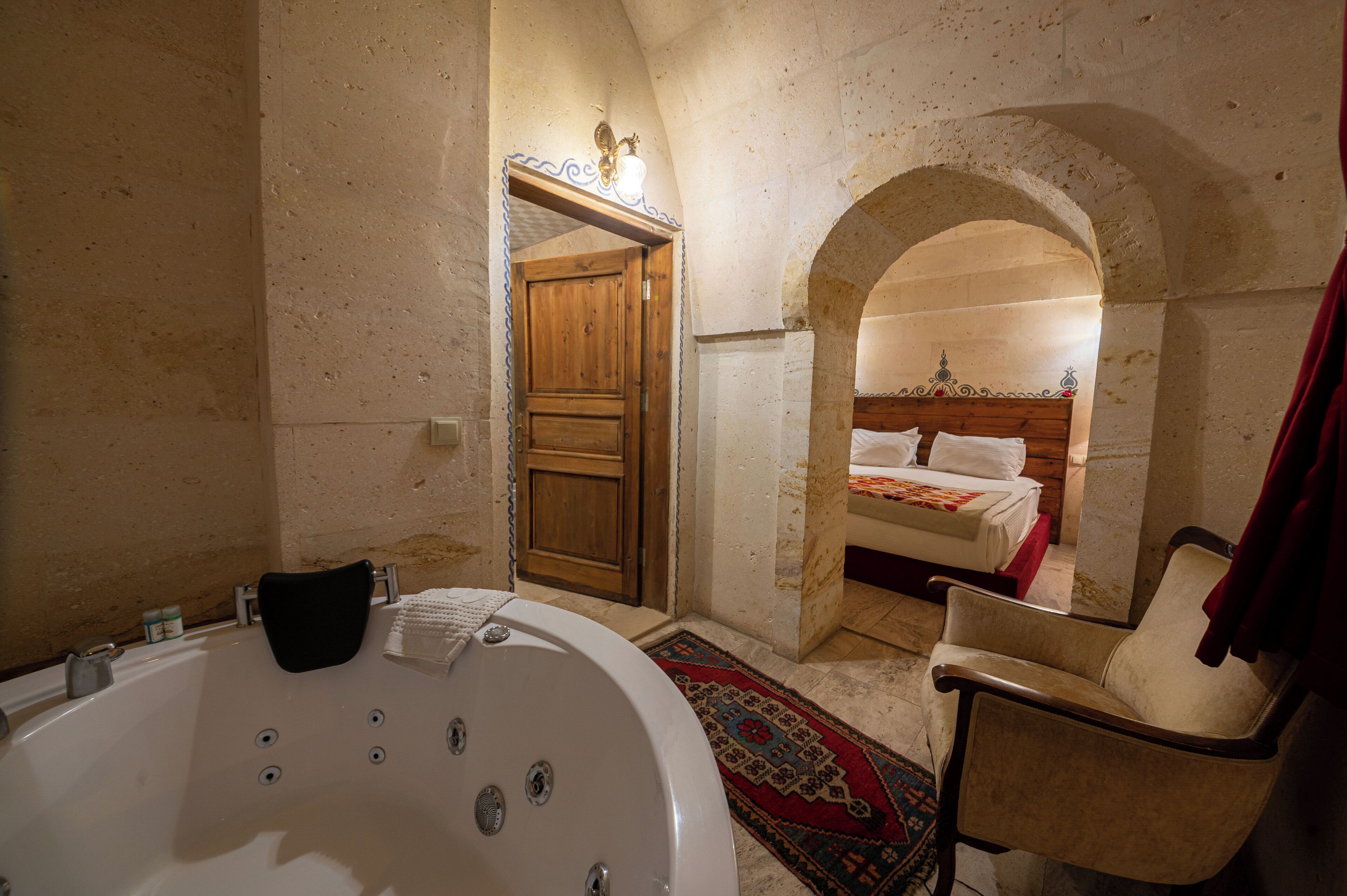A bathroom with a bathtub, a shower, and a towel rack.