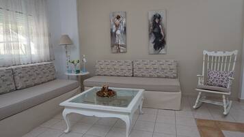 Apartment, 1 Bedroom | Living room | Flat-screen TV