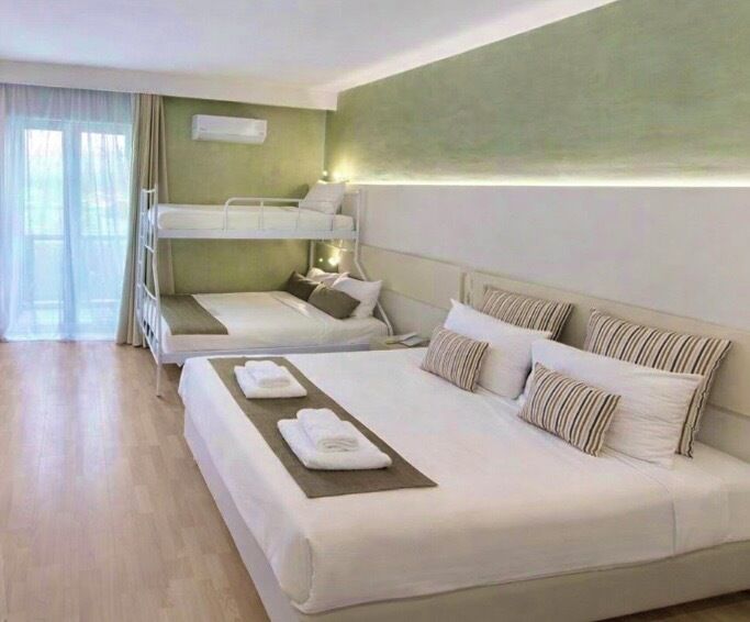 Family Quadruple Room | Egyptian cotton sheets, premium bedding, minibar, in-room safe