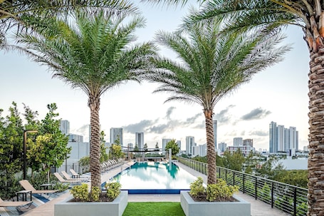 Outdoor pool, open 7:00 AM to 11:00 PM, sun loungers