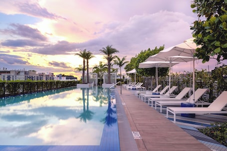 Outdoor pool, open 7:00 AM to 11:00 PM, sun loungers