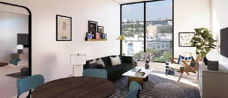 A modern living room with a large window, a sofa, a coffee table, and a dining table.