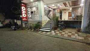 A hotel entrance with a checkered floor, a staircase, and a sign reading "Hotel Star Palace". - Hotel Star Palace (Jaipur)