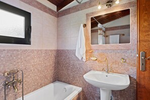 Combined shower/tub, hair dryer, towels, toilet paper
