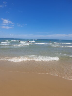 A beach with clear skies and calm waves. - Serenity (Poole)