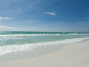A beach with clear turquoise water and white sand. - Short walk to pools & beach access!! Adjacent to tennis/pickleball facility! (Miramar Beach)