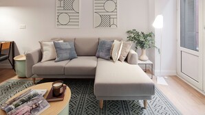 A modern living room with a sofa, ottoman, and coffee table, featuring geometric wall art and a potted plant. - Mayor Suite 3 by FeelFree Rentals (San Sebastián)