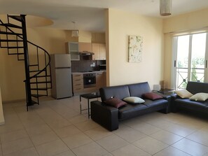 Penthouse Apartment (Max 6) | Living area | 32-inch flat-screen TV with digital channels, TV, DVD player